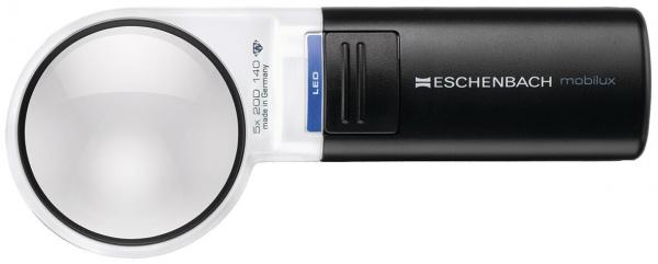 The image displays a black reading magnifier with a large, round lens and an integrated LED light. There is a compartment for batteries on the side. The magnifier has a modern, functional look.