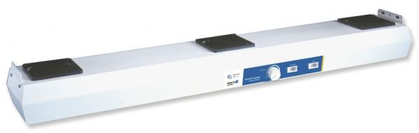 The image shows an elongated, white bar with two black pads at the ends. In the middle, there is a blue area with controls, presumably for operation.