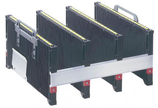The image shows a black storage box with multiple compartments divided by vertical dividers. The top edge has yellow markings, and the box stands stable on a flat surface.