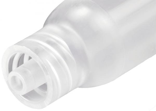 The image shows the top part of a clear plastic bottle with a narrow spout. The cap has a round, wavy structure and a small slot in the center.