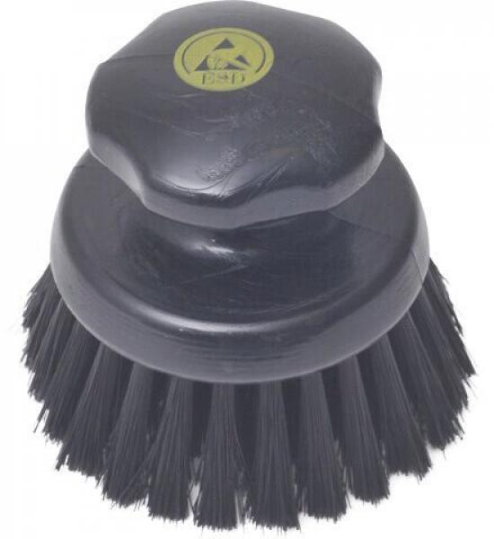 The image shows a black brush with a round, flat handle. The bristles are short and densely arranged, ideal for cleaning surfaces.