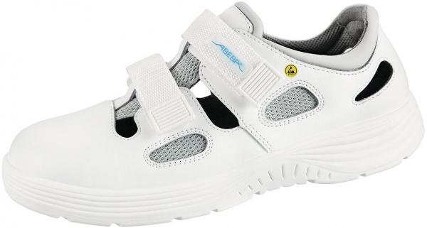 Der Schuh ist weiß mit grauen und schwarzen Details. Er hat eine gewölbte, rutschfeste Sohle, zwei Klettverschlüsse und atmungsaktive Einsätze. Ideal für Komfort und Halt.