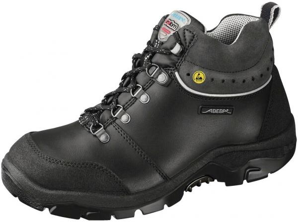 The shoe is a black, ankle-high hiking boot made of sturdy leather. It has a grippy sole and a waterproof membrane. The laces run through metal loops.