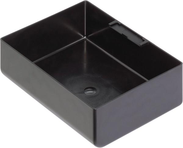 The image shows a rectangular, black plastic box. It has high walls and a smooth surface, with a partition in the middle and a small hole in the bottom.