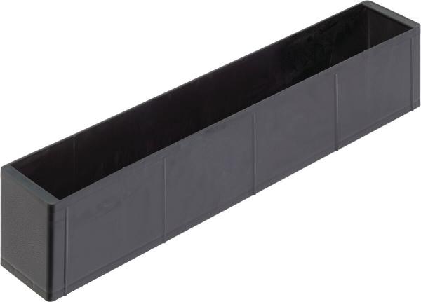 The image shows a long, narrow box in black color. The box has straight edges and a smooth surface, without a lid or any special decorations.