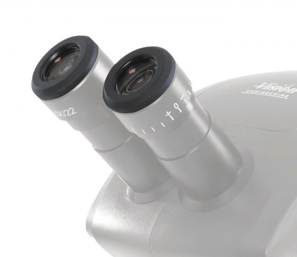 The image shows a microscope with two round eyepieces. The mounts are silver-colored and feature a scale. The design is compact and modern, ideal for scientific applications.