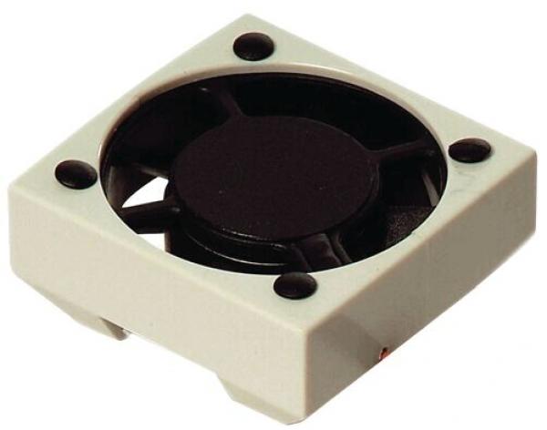 The image shows a small, square fan. It has a black rotor in the center and a light, rectangular frame with four mounting holes in the corners.