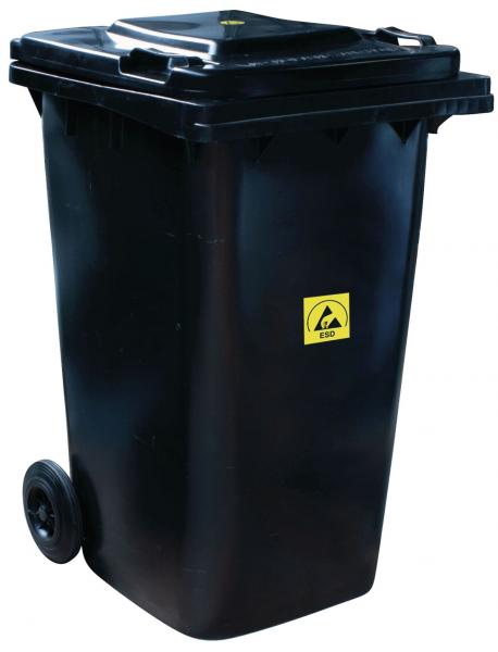 The black trash can has two wheels and a lid. On the front, there is a yellow warning symbol. It is rectangular and about hip-high.