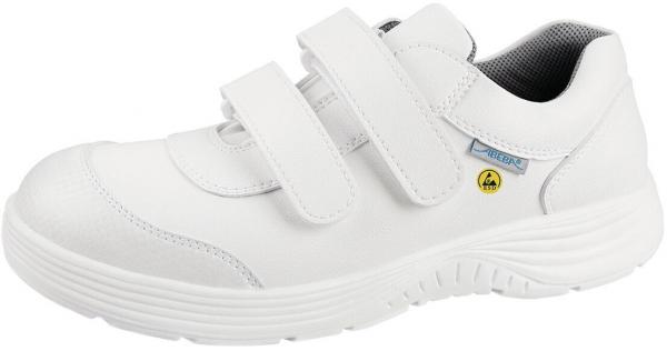 The shoe is white, with a comfortable, sporty design. It has two Velcro straps for easy on and off, and a textured, non-slip sole.