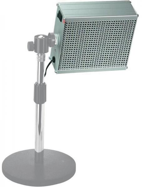 The image shows a rectangular lamp with a grid top, mounted on an adjustable metal stand. The base is flat and round. The lamp is intended for targeted lighting.