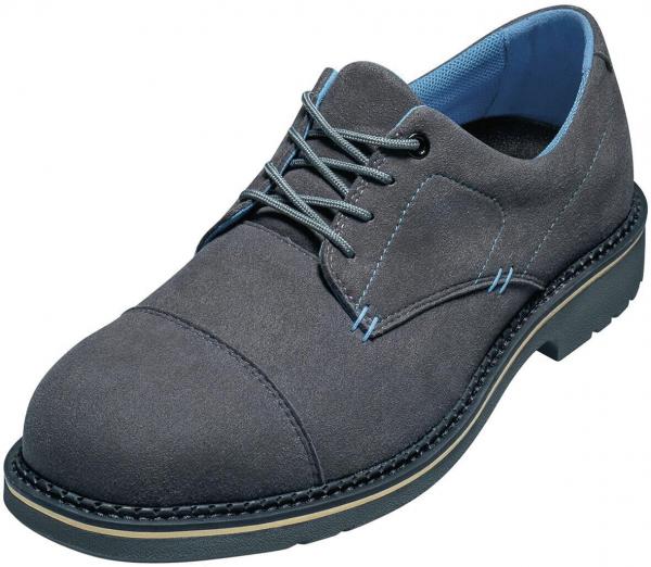 The shoe is a gray, lace-up suede half shoe. It has a round toe, a light blue lining, and a sturdy, black rubber sole with a shallow tread.