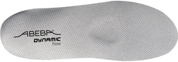 The image shows a gray shoe sole with a textured surface. The brand names "ABEBA" and "DYNAMIC flow" are displayed in black lettering. The shape is ergonomic.