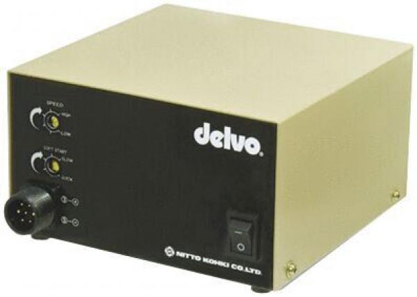 The image shows a compact, cube-shaped device in gold and black. On the front, there are switches and knobs. The "delvo" logo is prominently placed.