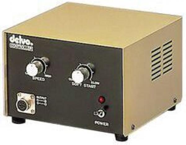 The image displays a rectangular device with a golden top and a black front. It features two large knobs for "Speed" and "Soft Start," as well as a power switch and a small red light indicator.