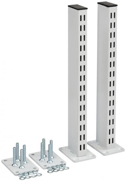 The image shows two tall, rectangular white metal bars standing vertically. Next to them are various metal parts and screws used for mounting.