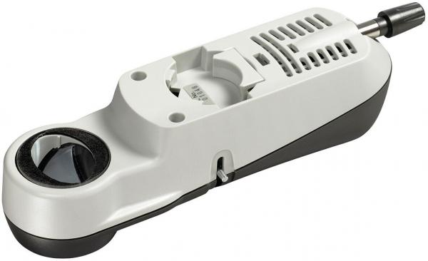 The image shows an electronic reading device. It has an elongated, ergonomic shape in gray and black, with a large lens on the front and buttons as well as ventilation slots on the top.