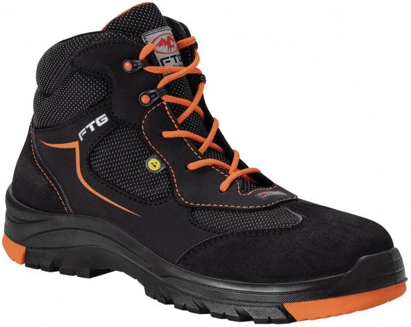 The shoe is a black hiking boot with orange laces and a sturdy sole. It has a high shape that supports the ankle, and is made from a mix of textile and leather.