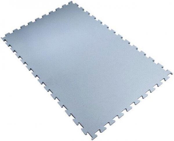 The image shows a large, rectangular mat made of gray foam. It has jagged edges that facilitate connecting with other mats. The surface is smooth and soft.