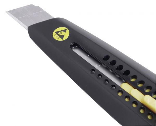 The image shows a black utility knife with a metal blade. The handle features yellow and black accents and holes for weight reduction. The blade is sharp and retractable.
