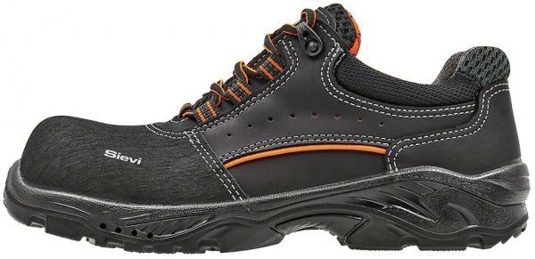 The shoe is black with orange accents. It has a round, reinforced toe cap, a non-slip sole, and laces. The surface features some texture details and ventilation elements.