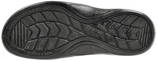 The image shows the underside of a shoe. The sole is black and features a textured, non-slip pattern with various grooves and profiles for good traction.