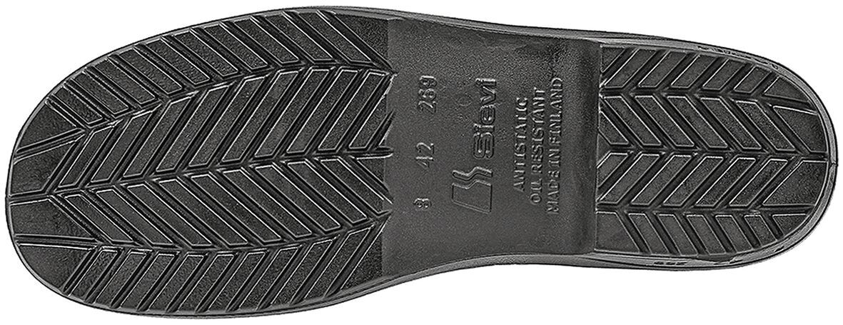 The image shows the underside of a black shoe. The sole is textured with a herringbone pattern for better grip. There are also some embossments visible on the sole.