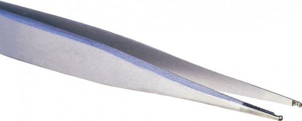 The image shows a silver tweezer. It has a pointed shape with two narrow gripping surfaces at one end. The surface is smooth and reflects light.