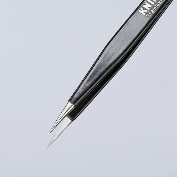 The image shows a long, pointed tweezer. It has a black, matte finish and two narrow, metallic tips that meet. The background is light and neutral.