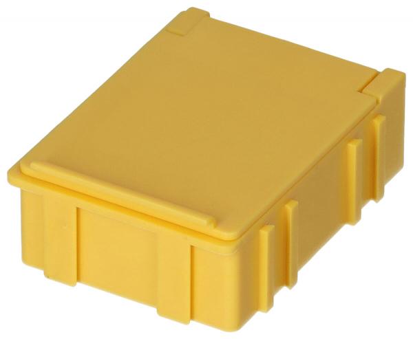 Das Bild zeigt eine rechteckige, gelbe Kunststoffbox mit einem flachen Deckel. Die Seiten sind leicht strukturiert und die Ecken sind abgerundet. Sie hat einen stabilen, kompakten Eindruck.