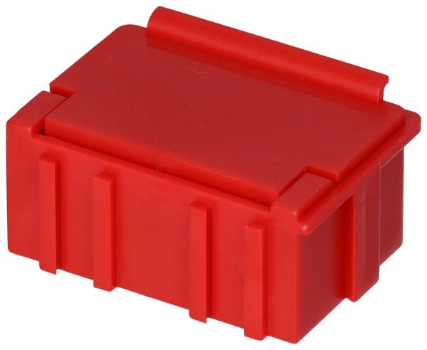Das Bild zeigt eine kleine, rechteckige Box in leuchtendem Rot. Sie hat eine flache, abgerundete Oberseite mit einem gerillten Rand und vertikalen Rillen an den Seiten.