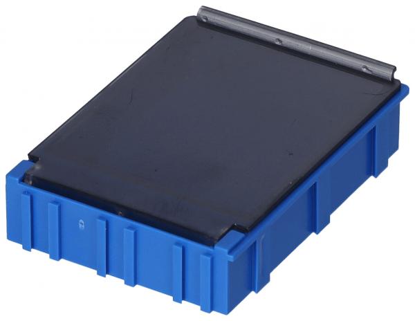 Das Bild zeigt eine rechteckige Box in kräftigem Blau mit einem flachen, schwarzen Deckel. Die Kanten sind strukturiert und die Unterseite hat kleine Noppen oder Rillen.