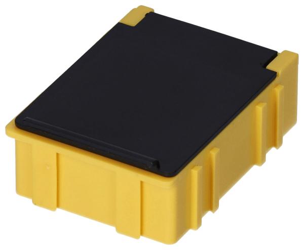 Das Bild zeigt eine rechteckige Box. Die Unterseite ist leuchtend gelb mit kleinen Rillen an den Seiten, die Oberseite ist schwarz und flach. Die Kanten sind leicht abgerundet.