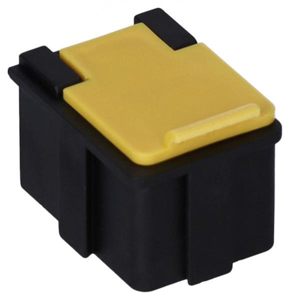 The image shows a small, rectangular black plastic container with a yellow lid. The lid has a slight elevation and a slot to facilitate opening.