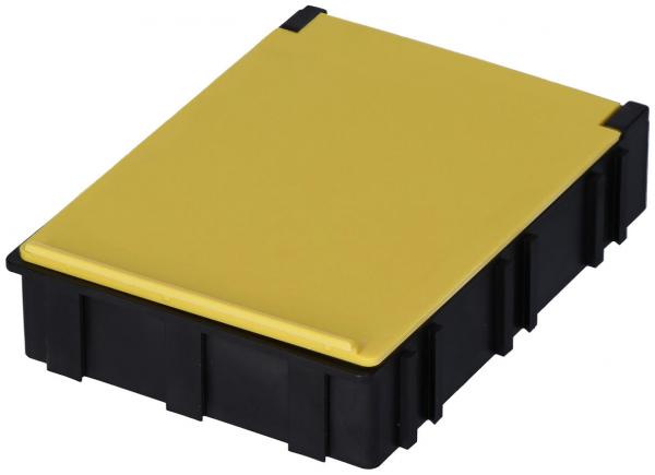 Das Bild zeigt eine rechteckige Box mit einem schwarzen Körper und einem gelben Deckel. Die Oberseite ist glatt, die Seiten sind strukturiert, was einen robusten Eindruck vermittelt.