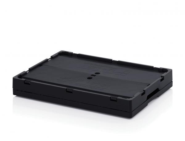 Das Bild zeigt eine rechteckige, flache schwarze Box mit einer strukturierten Oberfläche. An den Seiten befinden sich Befestigungselemente, die eine sichere Handhabung ermöglichen.