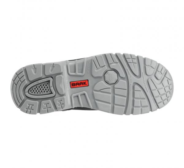 The image shows the sole of a sports shoe. It is light gray with a non-slip tread that consists of various patterns. In the center, the word "BRAK" is visible in red lettering.