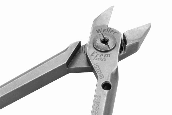 The image shows a large, silver pliers with two long handles and a pointed edge. The pliers have a labeled joint connection and are designed for precise tasks.