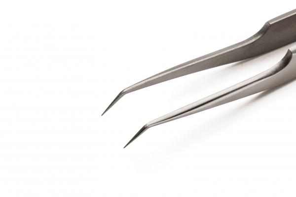 The image shows a silver tweezer with sharp, fine tips. It is slender and has a smooth surface, ideal for gripping small objects. The background is white.