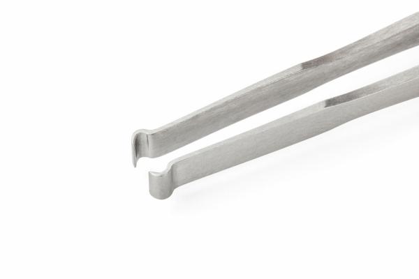 The image shows a metallic tweezer with two long, narrow arms that are slightly bent outward at one end. The surface is shiny and smooth.