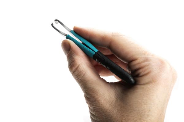 A hand is holding a pair of tweezers. These are made of metal with two serrated ends and a blue handle. The background is light and unobtrusive.