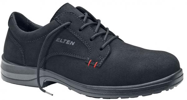 The shoe is a black, lace-up safety shoe with a sturdy upper. The sole is slip-resistant and has a raised edge. Red accents are visible on the side.