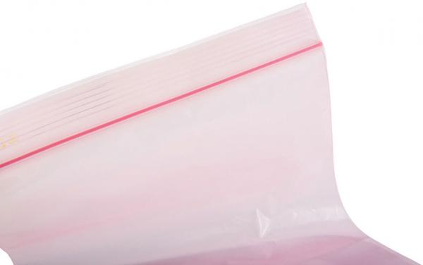 The image shows a transparent, resealable plastic bag. The top edge has a red stripe indicating the closure. The bag is partially filled.