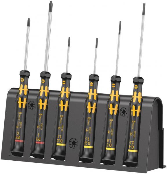 The image shows a holder with six screwdrivers. They have black handles with yellow details. The screwdrivers vary in length and have different tip shapes.