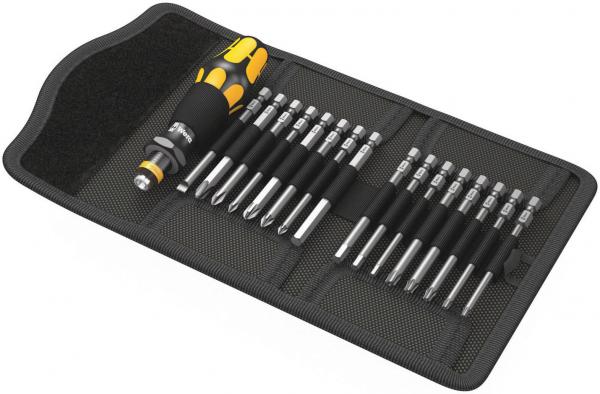 The image displays a toolset in a black storage bag. At the center is a screwdriver with a yellow handle. Adjacent to it are several bits in various lengths.