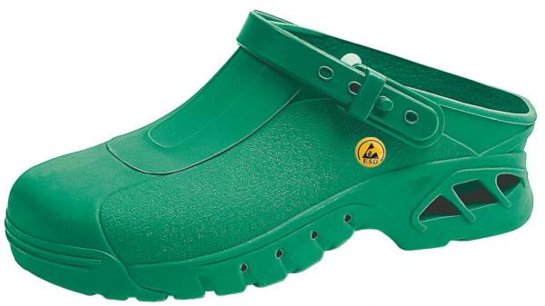 The image shows a green plastic clog shoe. It has a closed front, an adjustable strap at the heel, and ventilation slots on the sides.