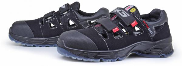 These are black safety shoes with a sturdy rubber sole and multiple Velcro fastenings. They feature closed toes and side ventilation openings for comfort.