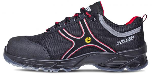 The shoe is black with striking red accents. It has a chunky sole and is made of sturdy, breathable material. Laces and a sporty design emphasize its functional style.