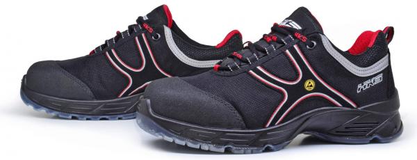 The image shows a pair of black safety shoes. They have a sturdy, padded sole, red accents, and a sporty lacing. The shoes are designed to be modern and functional.
