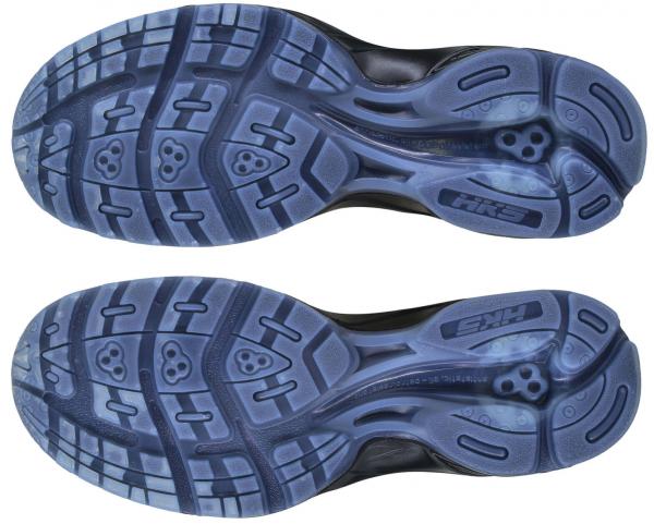 The image shows the sole of a sports shoe in dark blue with a textured design. The sole features various patterns that provide grip and flexibility.