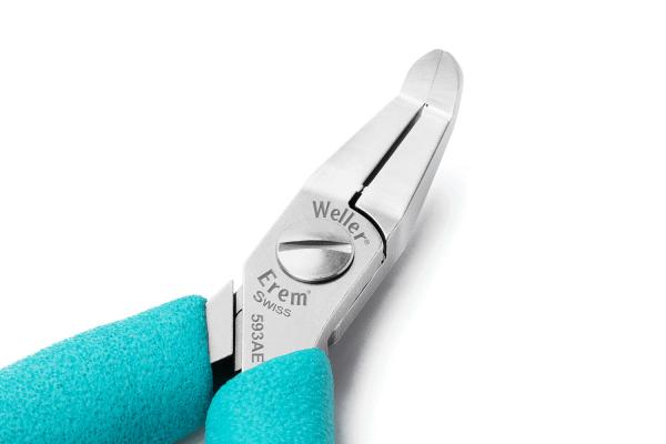 The image shows a two-sided pliers with a smooth, angled cutting edge. The handle is turquoise and has a textured surface for better grip. There are markings visible on the pliers.